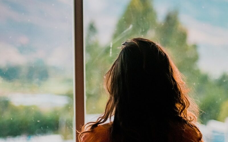 Woman Wearing Brown Shirt Inside Room
